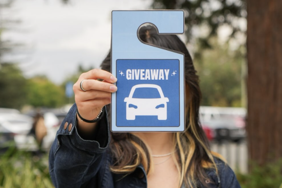 Parking Pass Someone holding a parking pass in front of their face