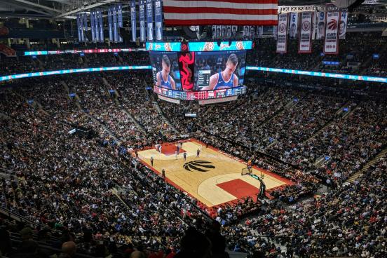 Basketball Arena An indoor basketball arena with people in the stands