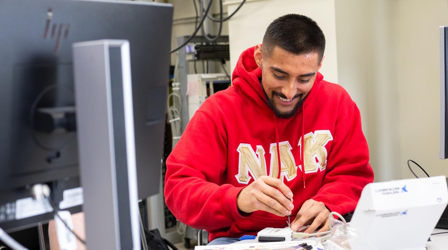 Student working on a  project in an electrical engineering lab