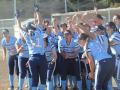 The Sonoma State softball team cheering and celebrating on the softball field 