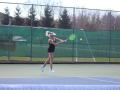 Student playing tennis 