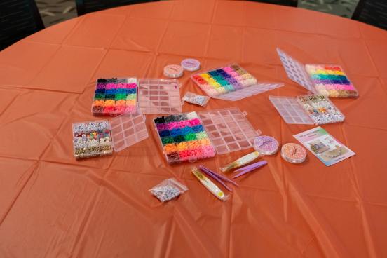 Table full of beads and bands
