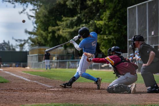 Batter swings in a game of baseball