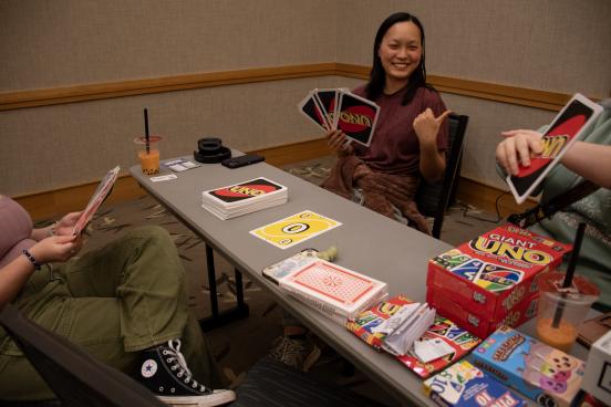 A group plays a game of giant UNO