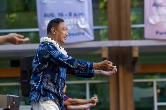 A dancer performs a traditional routine on stage