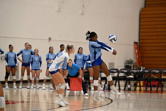 Someone mid-spike of a volleyball