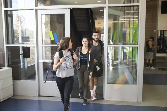 Group of students walk out of the rec center