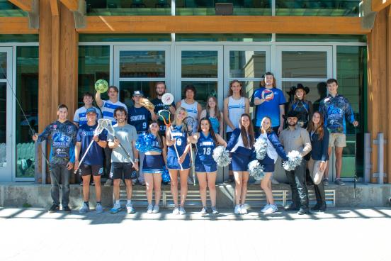 Various athletes stand together