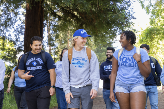 Students walk together in the woods