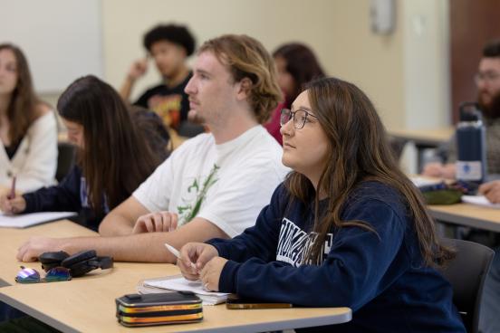 Students sitting in a classroom looking forward