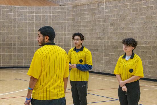 Referees gathered in a gym