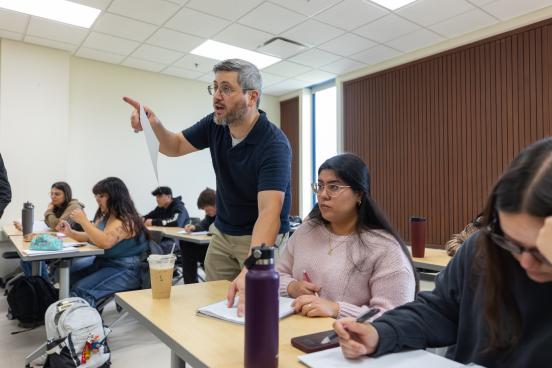 Teacher helps answer student's question