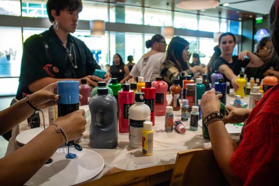 Groups of students use paint