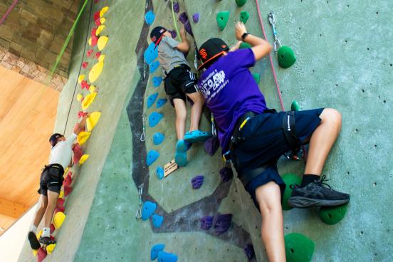 Student climbs rec center rock wall