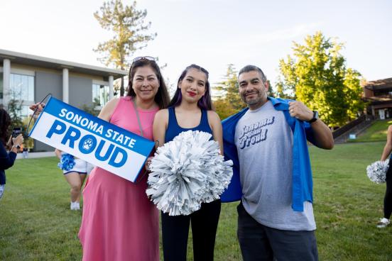 A family poses with SSU merch