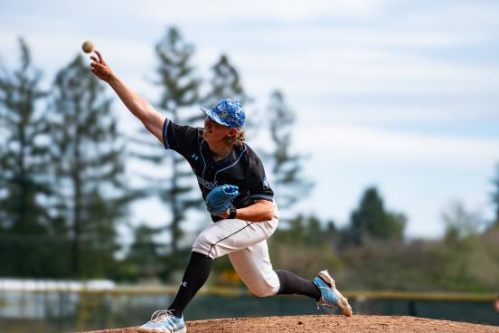 Player reaching for a baseball