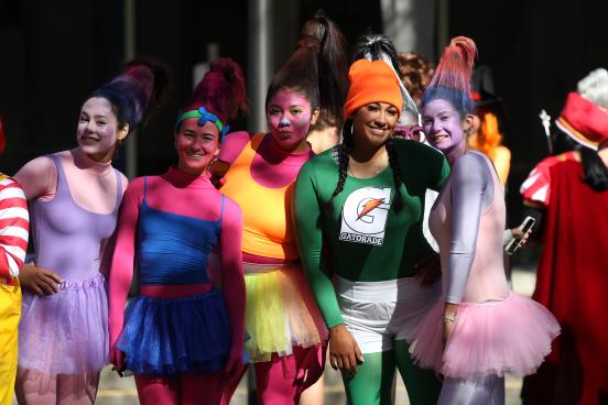 Group poses in halloween costumes