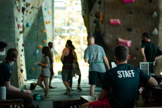 Students gather at the rec center rock wall