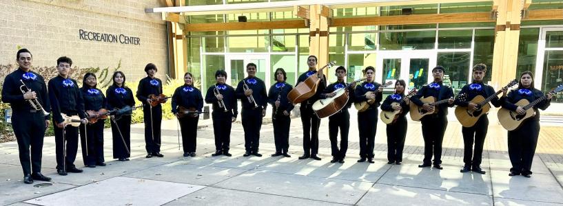 The Lobos Mariachi band posing with their instruments outside of the SSU Recreation Center