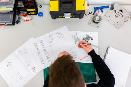 Somone drawing engineering materials 