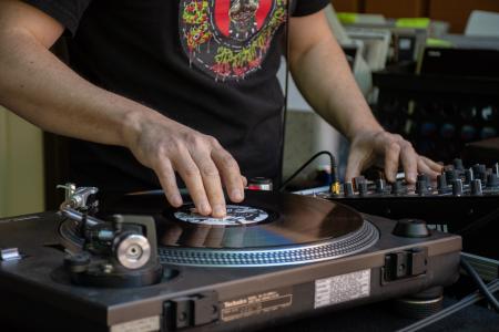 Close up shot of a DJ spinning records