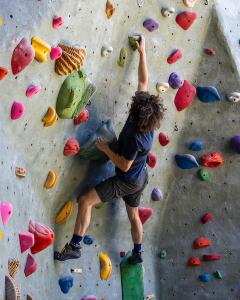 Person climbing on rock wall