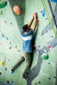 Person climbing on rock wall
