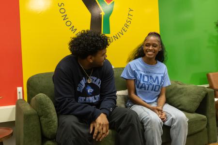 Two students sitting in the HUB