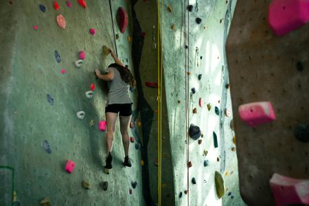 Student climbs rec center rock wall