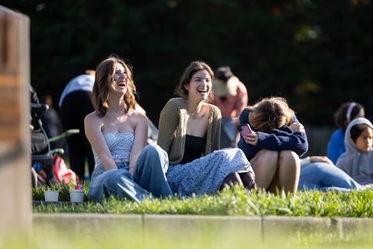 Group laughing together on the lawn