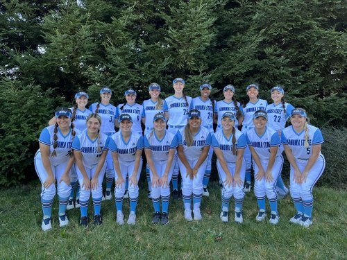 The members of the SSU Softball team posing together in their uniforms 