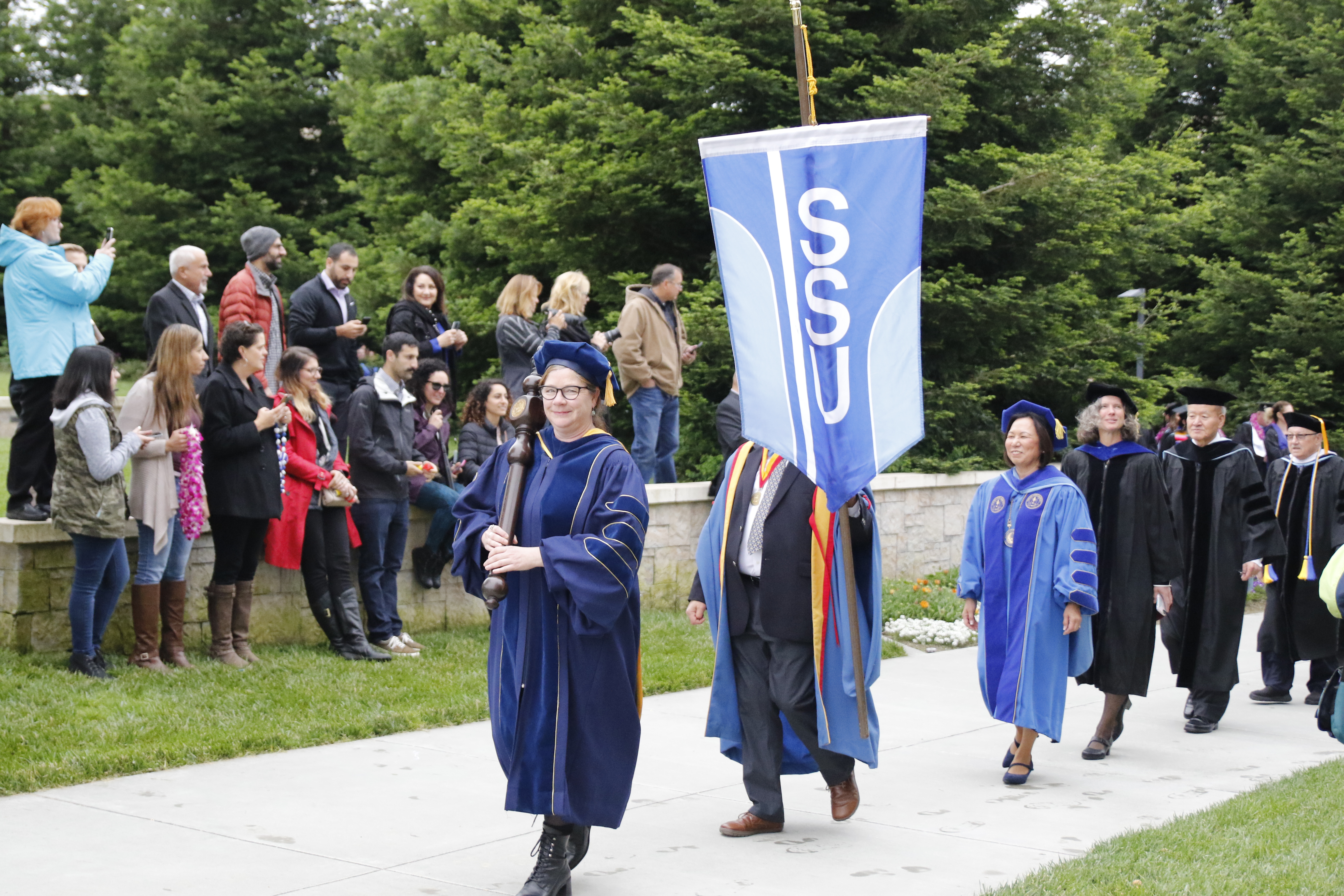 Processional of faculty with SSU banner at commencement