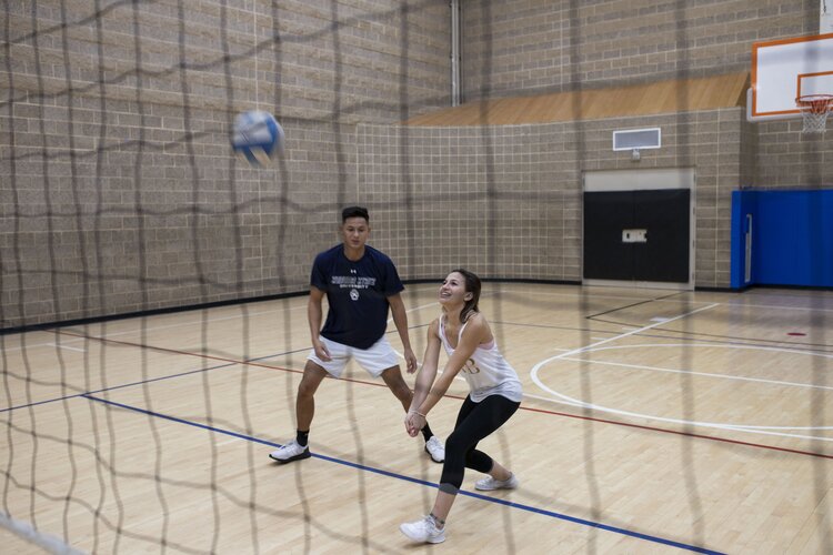 Students playing volleyball 