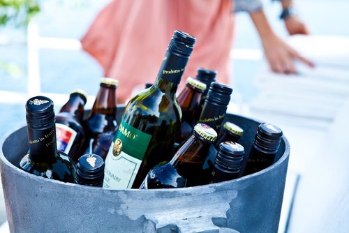 Bucket filled with alcohol bottles 