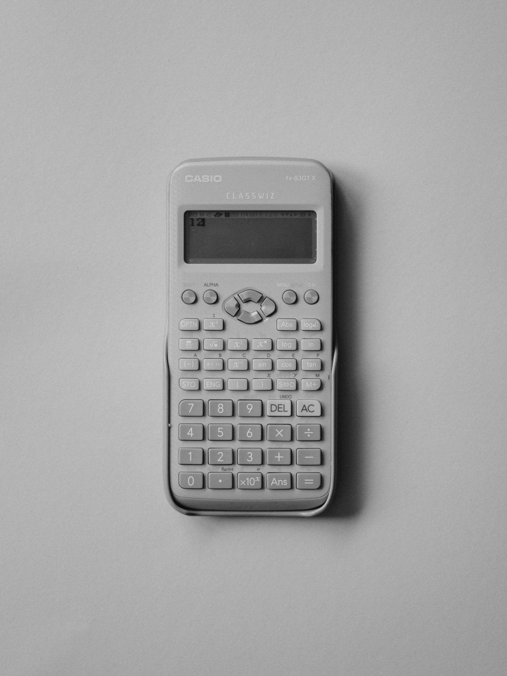 A black and white image of a T9 calculator 