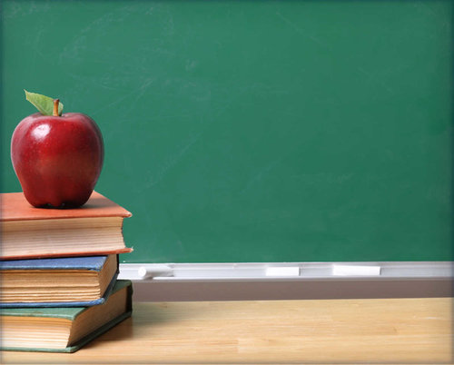 Red apple on top of books