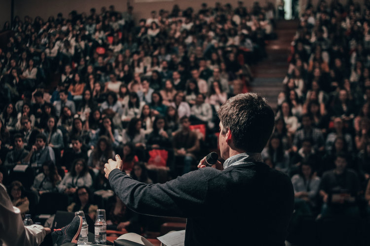 Person speaking to an audience