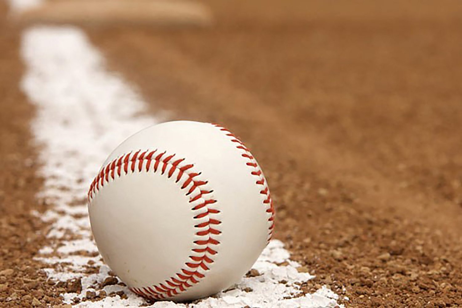 baseball on ground of baseball diamond