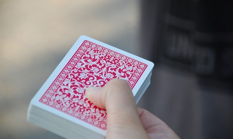Someone holding a stack of cards