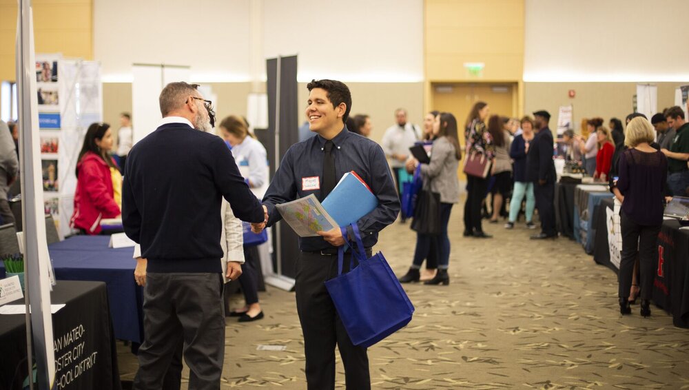 Student shaking an employer's hand 