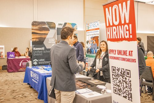 People talking at the indoor Career Fair