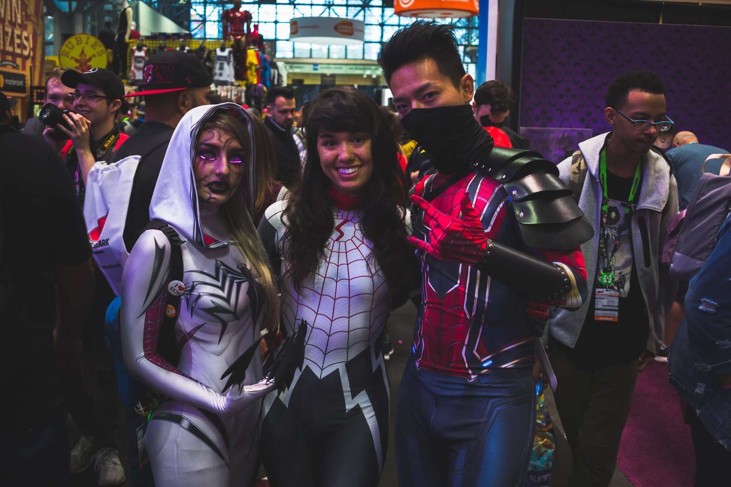three people dressed in Spiderman cosplay