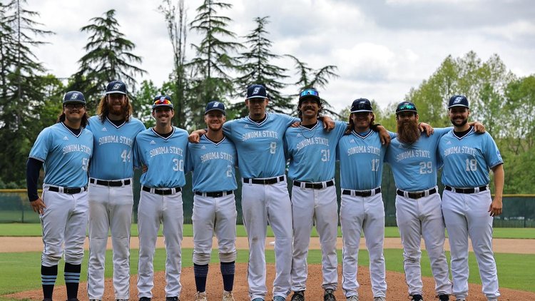 Members of the SSU Baseball team posing in their uniforms together