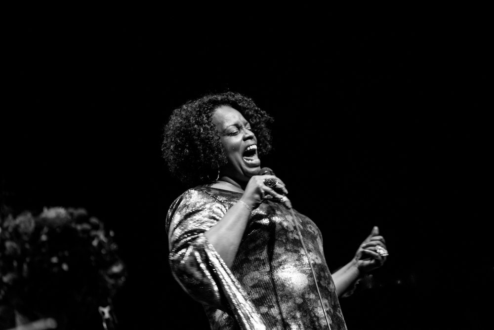 Dianne Reeves singing on the microphone