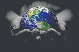 hands holding the globe