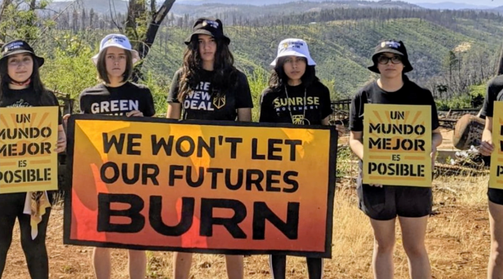 Film poster for 'Embers of the Awakening' featuring people holding signs that say 'We won't let our futures burn"