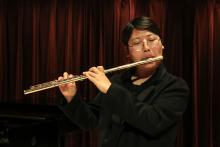 A musician playing a flute 