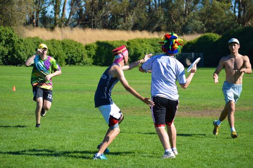 men play frisbee 