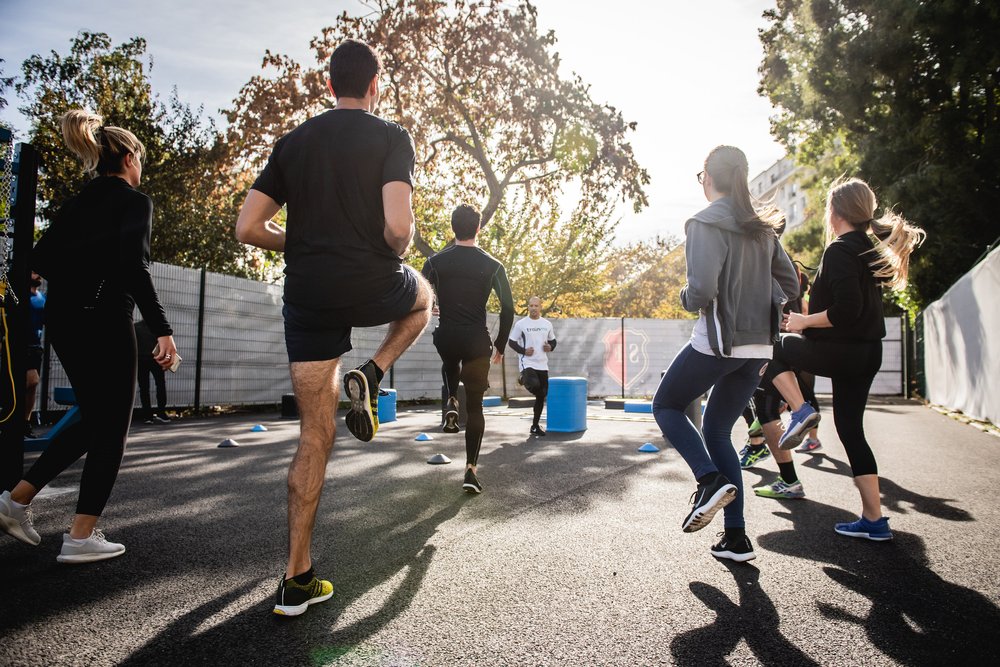 A group of people working out outdoors