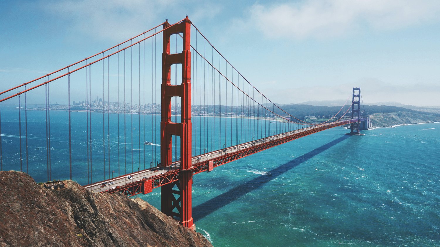 The Golden Gate Bridge with clouds in the background